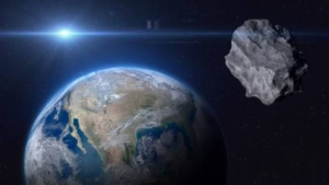 Illustration of the 1997 NC1 asteroid during its close Earth flyby with the planet visible in space