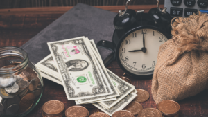 Saving vs investing comparison table highlighting short-term savings and long-term investment benefits.