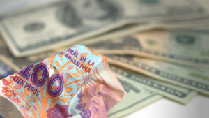 Currency devaluation effects impacting businesses and consumer purchasing power