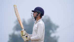 Batsman running between wickets explaining how is cricket played