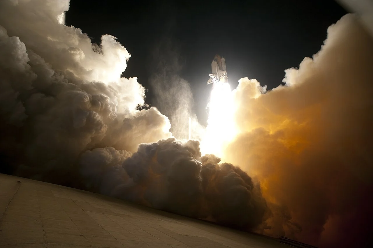 A rocket launching into space carrying a scientific telescope.